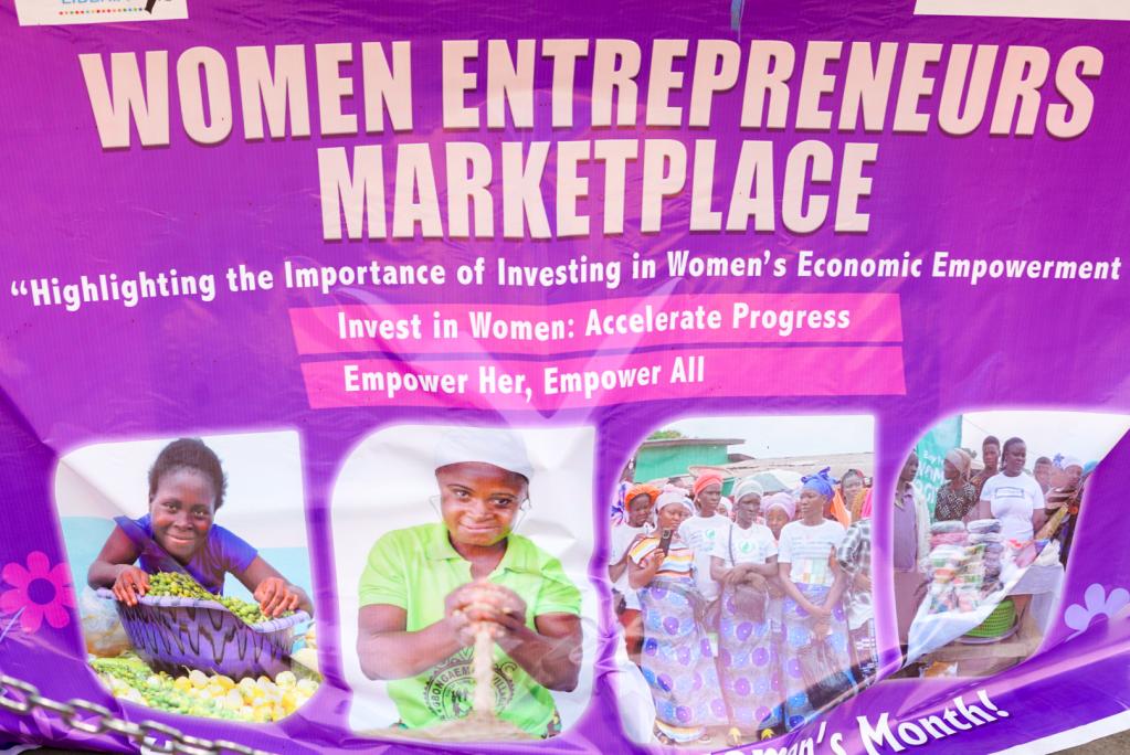 A banner with photos of women selling food