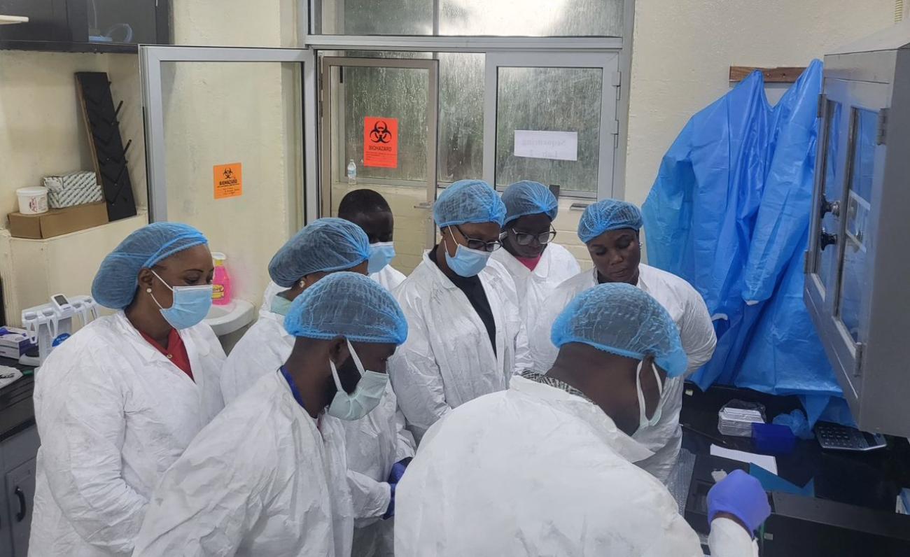 Group of people in white coats standing together