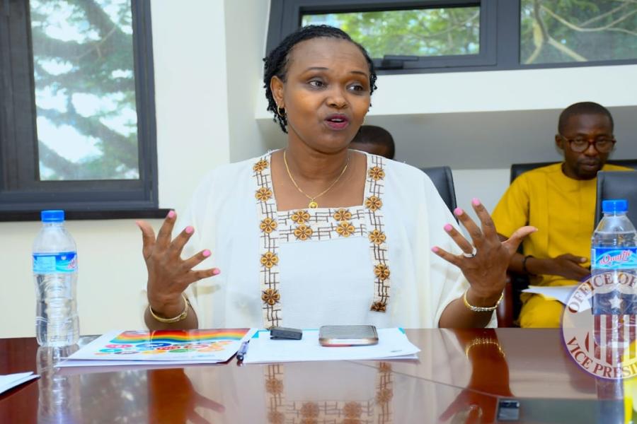 Madame Umutoni gesturing with hands during discussion 