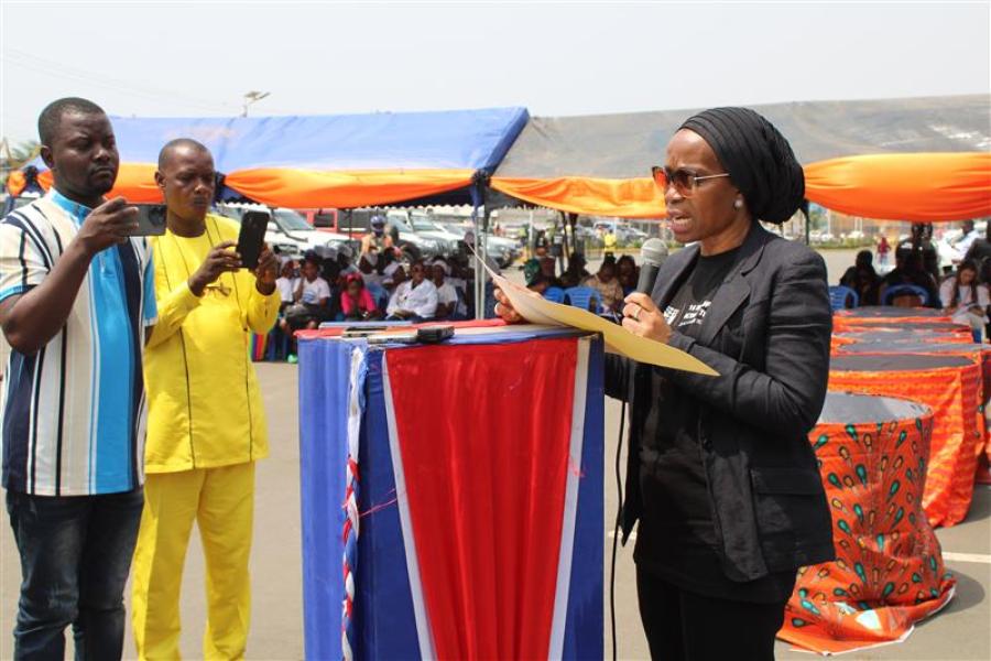 Women speaking at the podium on microphone