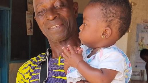 Esther being held by her Grandfather
