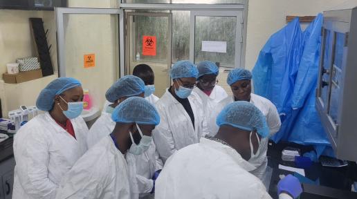 Group of people in white coats standing together